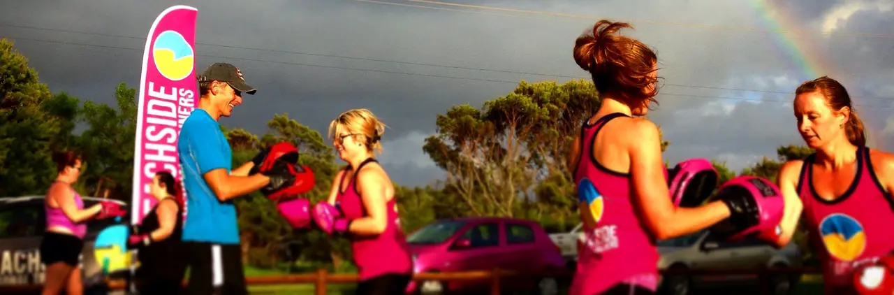 Boxing pad work beside the beach