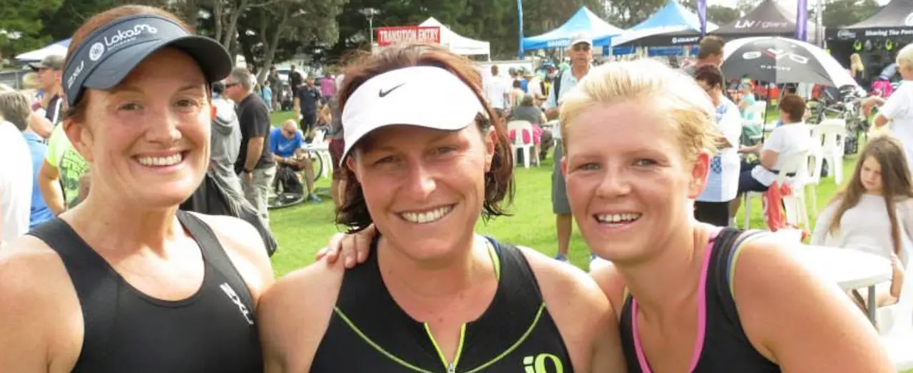 Three Beachside members smiling at an event